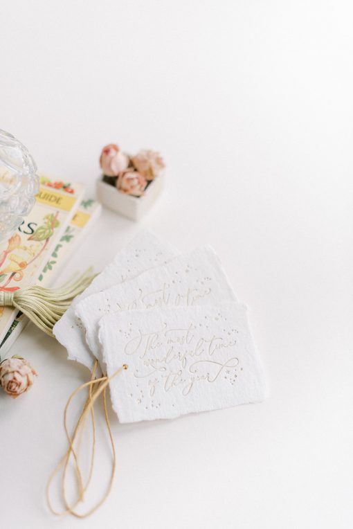 Handmade paper gift tags with gold paper twine