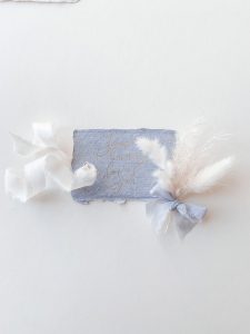 Blue gift tags with the words some bunny loves you. Gold foil on blue paper