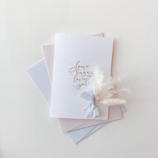 White bunny loves card with gold foil and blind emboss polka dots.