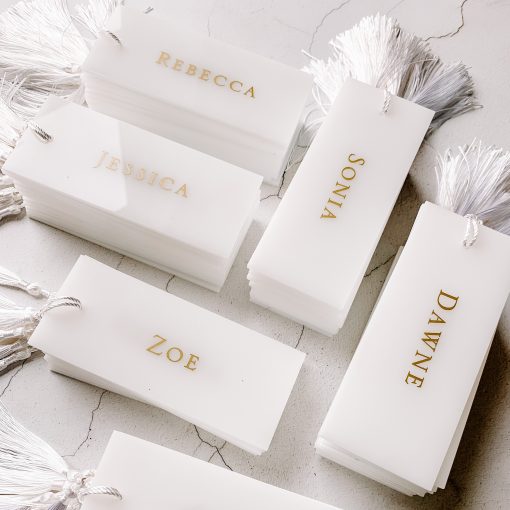 White acrylic with gold name and white tassel