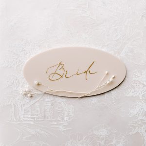 Oval Name Card on beige acrylic with a gold vinyl name