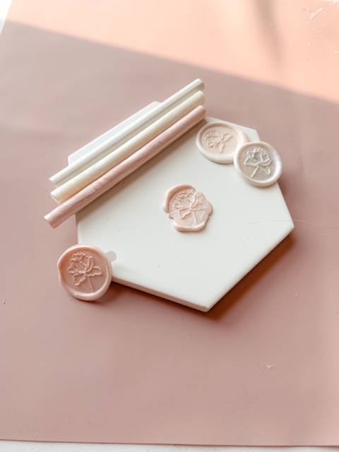 Branded wax seal stamp in different shades of ivory and pink