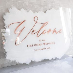 Welcome sign with rose gold foil and white paint