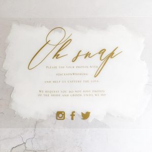 Welcome sign with gold foil on clear acrylic and white paint